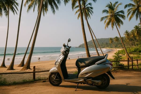 Scooter parked near a beach trail in North Goa for beach hopping - Goa budget travel