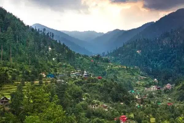 Traditional wooden cottages and natural stream in Jibhi, Himachal